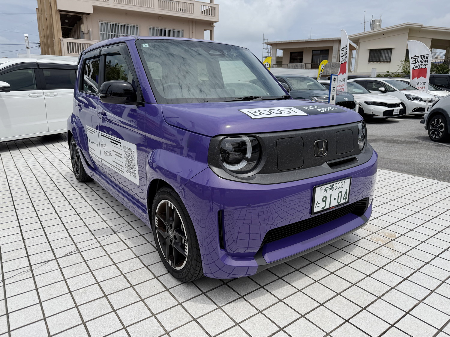 ブーストバイオレット・パールのホンダ Super-ONE フロント斜め